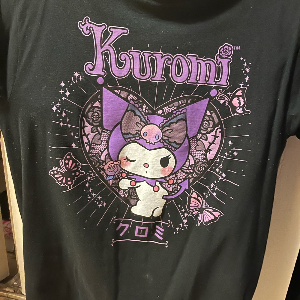 A size Large Kuromi (by Sanrio) from Hot Topic purple, white and black t-shirt.